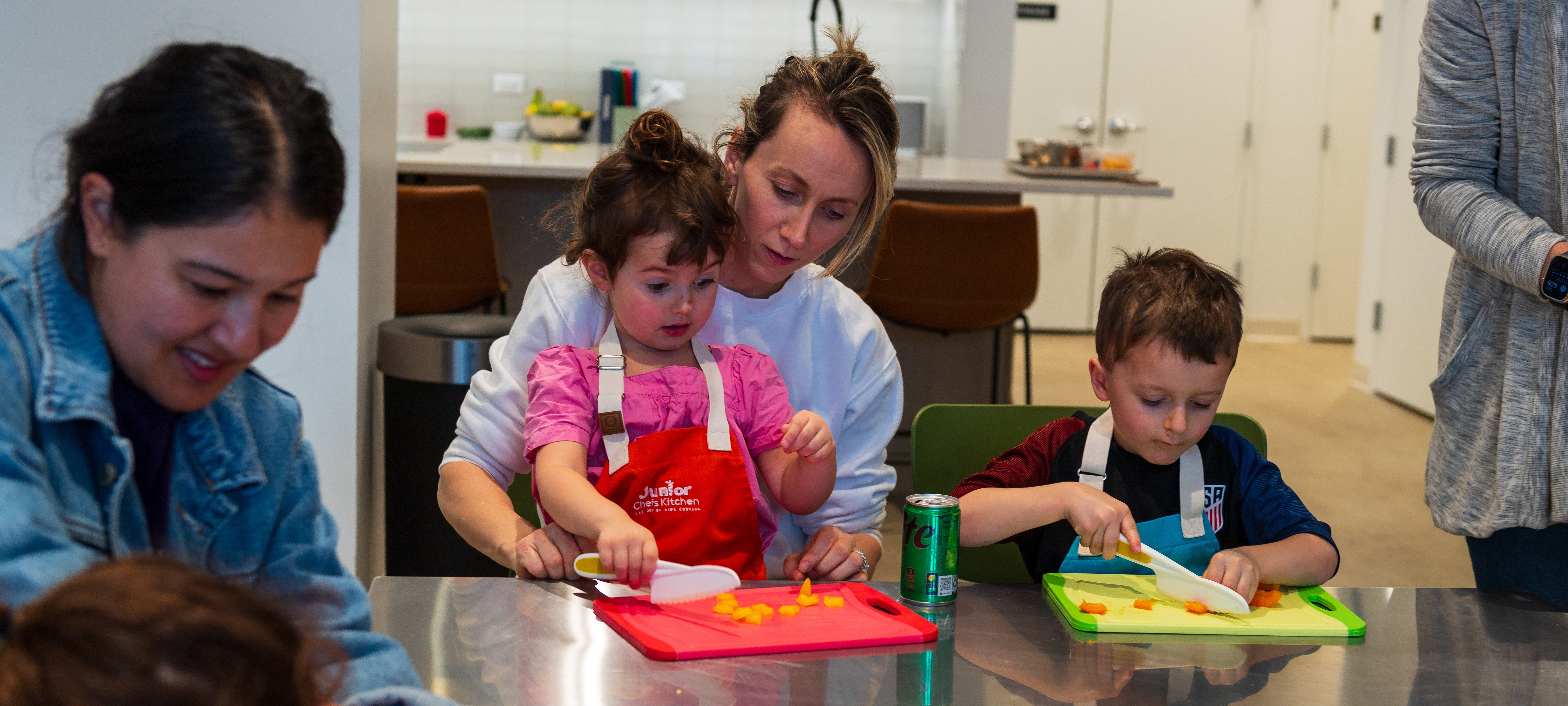 Children chop peppers during Junior Chefs Kitchen class 